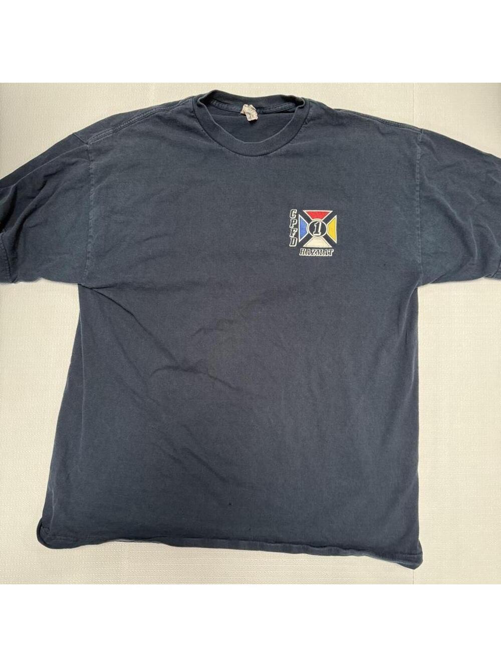 CPD HAZMAT T-shirt with red, blue, and yellow cross logo
